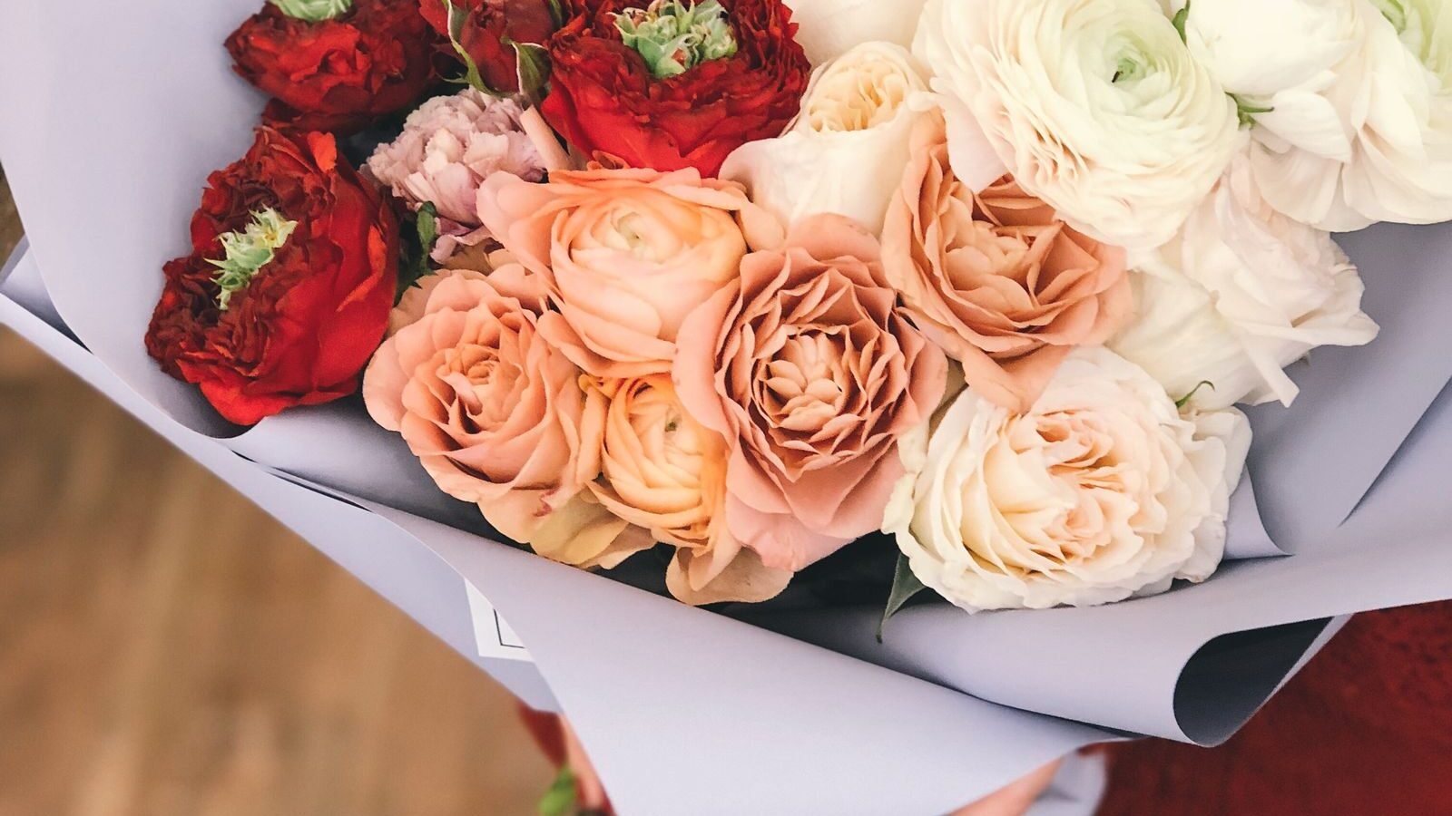 Bouquet of red, peach and white roses
